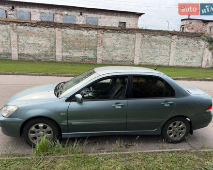 Серый Мицубиси Лансер, объемом двигателя 1.58 л и пробегом 260 тыс. км за 4050 $, фото 4 на Automoto.ua