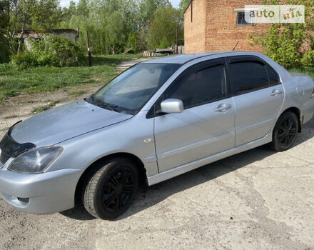 Сірий Міцубісі Lancer, об'ємом двигуна 1.58 л та пробігом 211 тис. км за 3999 $, фото 4 на Automoto.ua