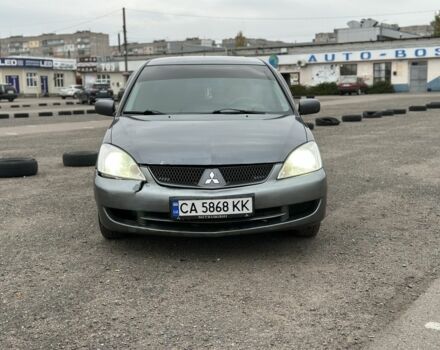 Серый Мицубиси Лансер, объемом двигателя 1.6 л и пробегом 250 тыс. км за 2550 $, фото 1 на Automoto.ua