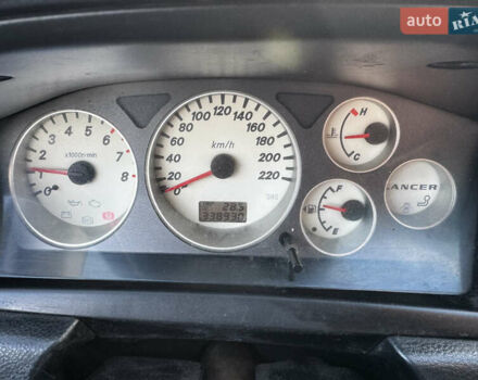 Сірий Міцубісі Lancer, об'ємом двигуна 1.58 л та пробігом 333 тис. км за 2700 $, фото 13 на Automoto.ua