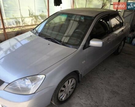 Сірий Міцубісі Lancer, об'ємом двигуна 1.58 л та пробігом 186 тис. км за 4300 $, фото 5 на Automoto.ua
