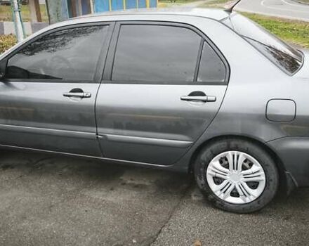 Серый Мицубиси Лансер, объемом двигателя 1.6 л и пробегом 263 тыс. км за 3800 $, фото 3 на Automoto.ua