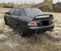 Міцубісі Lancer 2006 у Синельниковом на Automoto.ua Сірий Міцубісі Lancer, об'ємом двигуна 2 л та пробігом 200 тис. км за 3000 $, фото 1 на Automoto.ua