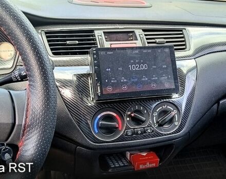 Серый Мицубиси Лансер, объемом двигателя 1.6 л и пробегом 275 тыс. км за 4700 $, фото 4 на Automoto.ua