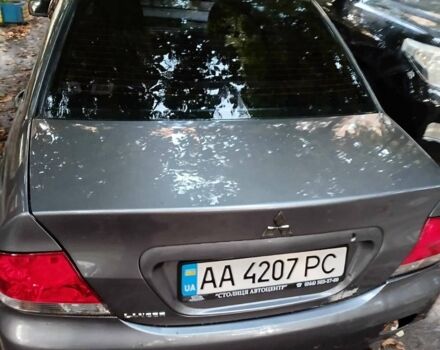 Сірий Міцубісі Lancer, об'ємом двигуна 1.58 л та пробігом 205 тис. км за 4000 $, фото 2 на Automoto.ua
