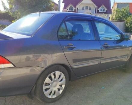 Сірий Міцубісі Lancer, об'ємом двигуна 1.6 л та пробігом 229 тис. км за 4900 $, фото 12 на Automoto.ua