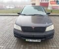 Серый Мицубиси Лансер, объемом двигателя 2 л и пробегом 215 тыс. км за 2900 $, фото 5 на Automoto.ua