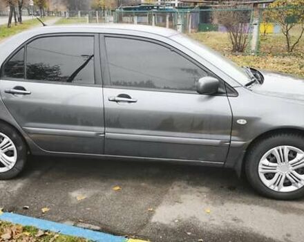 Серый Мицубиси Лансер, объемом двигателя 1.6 л и пробегом 263 тыс. км за 3800 $, фото 9 на Automoto.ua