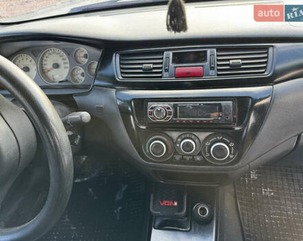 Сірий Міцубісі Lancer, об'ємом двигуна 1.58 л та пробігом 333 тис. км за 2999 $, фото 11 на Automoto.ua
