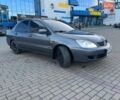Серый Мицубиси Лансер, объемом двигателя 1.6 л и пробегом 279 тыс. км за 3990 $, фото 1 на Automoto.ua