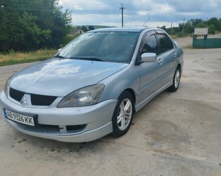 Серый Мицубиси Лансер, объемом двигателя 2 л и пробегом 306 тыс. км за 4100 $, фото 7 на Automoto.ua