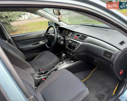 Серый Мицубиси Лансер, объемом двигателя 1.58 л и пробегом 260 тыс. км за 4050 $, фото 9 на Automoto.ua