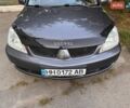 Сірий Міцубісі Lancer, об'ємом двигуна 1.58 л та пробігом 325 тис. км за 4000 $, фото 1 на Automoto.ua