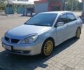 Сірий Міцубісі Lancer, об'ємом двигуна 1.58 л та пробігом 265 тис. км за 2900 $, фото 1 на Automoto.ua