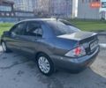 Сірий Міцубісі Lancer, об'ємом двигуна 1.58 л та пробігом 276 тис. км за 3650 $, фото 7 на Automoto.ua