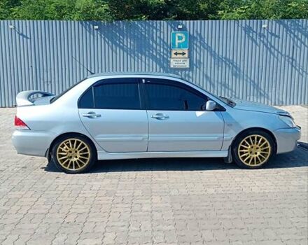 Сірий Міцубісі Lancer, об'ємом двигуна 1.58 л та пробігом 265 тис. км за 2900 $, фото 2 на Automoto.ua