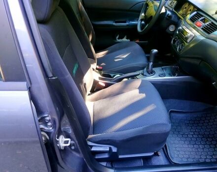 Серый Мицубиси Лансер, объемом двигателя 1.6 л и пробегом 177 тыс. км за 4000 $, фото 4 на Automoto.ua