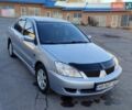 Сірий Міцубісі Lancer, об'ємом двигуна 1.58 л та пробігом 207 тис. км за 4300 $, фото 2 на Automoto.ua