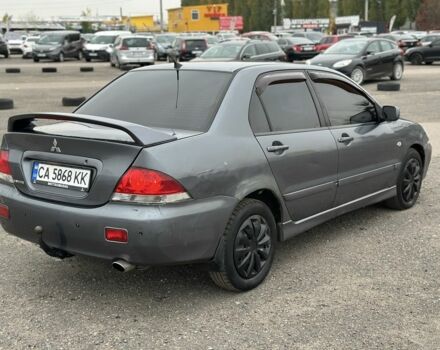Серый Мицубиси Лансер, объемом двигателя 1.6 л и пробегом 250 тыс. км за 2550 $, фото 3 на Automoto.ua
