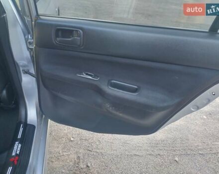 Серый Мицубиси Лансер, объемом двигателя 1.58 л и пробегом 250 тыс. км за 4700 $, фото 10 на Automoto.ua