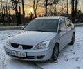 Серый Мицубиси Лансер, объемом двигателя 1.6 л и пробегом 240 тыс. км за 4600 $, фото 1 на Automoto.ua