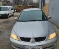 Серый Мицубиси Лансер, объемом двигателя 1.6 л и пробегом 319 тыс. км за 3402 $, фото 1 на Automoto.ua