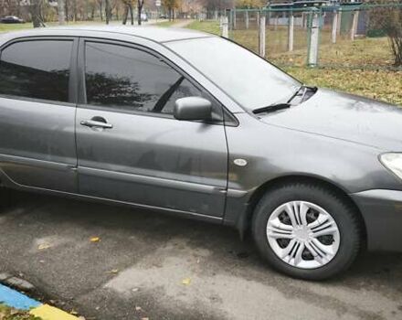 Серый Мицубиси Лансер, объемом двигателя 1.6 л и пробегом 263 тыс. км за 3800 $, фото 7 на Automoto.ua