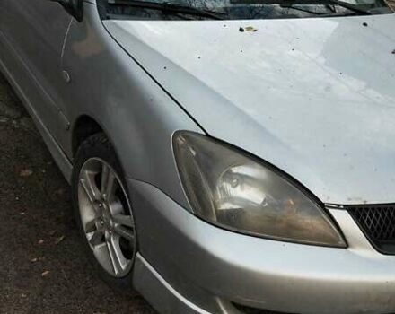 Серый Мицубиси Лансер, объемом двигателя 2 л и пробегом 284 тыс. км за 4100 $, фото 2 на Automoto.ua