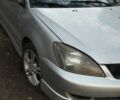 Серый Мицубиси Лансер, объемом двигателя 2 л и пробегом 284 тыс. км за 4100 $, фото 2 на Automoto.ua