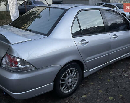 Серый Мицубиси Лансер, объемом двигателя 2 л и пробегом 307 тыс. км за 3999 $, фото 12 на Automoto.ua