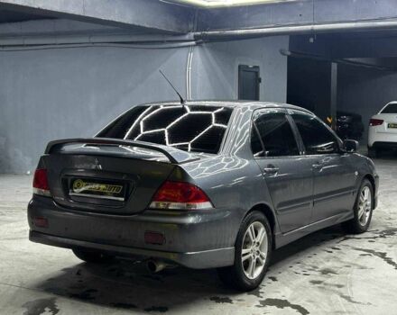 Серый Мицубиси Лансер, объемом двигателя 1.6 л и пробегом 300 тыс. км за 4600 $, фото 5 на Automoto.ua