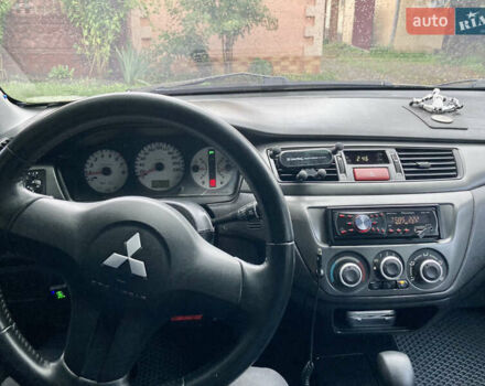 Сірий Міцубісі Lancer, об'ємом двигуна 1.6 л та пробігом 222 тис. км за 4900 $, фото 8 на Automoto.ua
