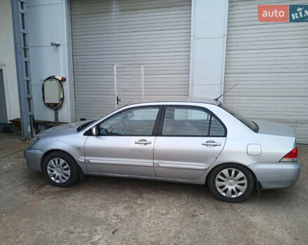 Серый Мицубиси Лансер, объемом двигателя 1.58 л и пробегом 215 тыс. км за 4000 $, фото 4 на Automoto.ua