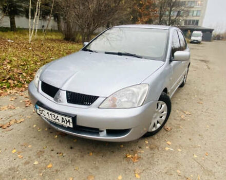 Серый Мицубиси Лансер, объемом двигателя 1.6 л и пробегом 253 тыс. км за 2850 $, фото 1 на Automoto.ua