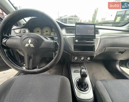 Сірий Міцубісі Lancer, об'ємом двигуна 1.58 л та пробігом 162 тис. км за 4650 $, фото 14 на Automoto.ua