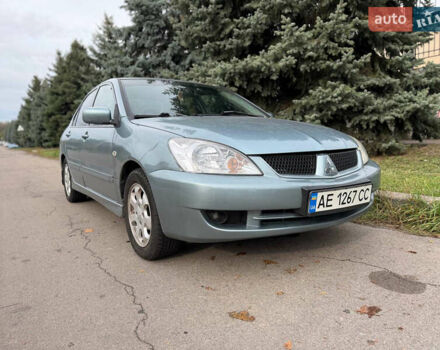 Серый Мицубиси Лансер, объемом двигателя 1.58 л и пробегом 260 тыс. км за 4050 $, фото 1 на Automoto.ua