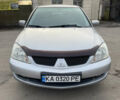 Сірий Міцубісі Lancer, об'ємом двигуна 1.58 л та пробігом 430 тис. км за 2550 $, фото 1 на Automoto.ua