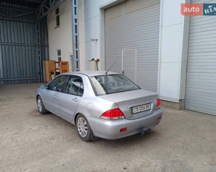 Серый Мицубиси Лансер, объемом двигателя 1.58 л и пробегом 215 тыс. км за 4000 $, фото 5 на Automoto.ua