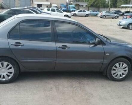 Серый Мицубиси Лансер, объемом двигателя 1.58 л и пробегом 271 тыс. км за 4600 $, фото 5 на Automoto.ua