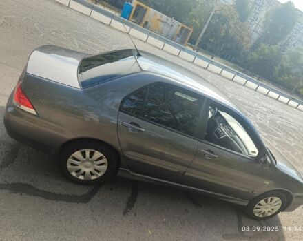 Сірий Міцубісі Lancer, об'ємом двигуна 1.6 л та пробігом 240 тис. км за 4400 $, фото 1 на Automoto.ua