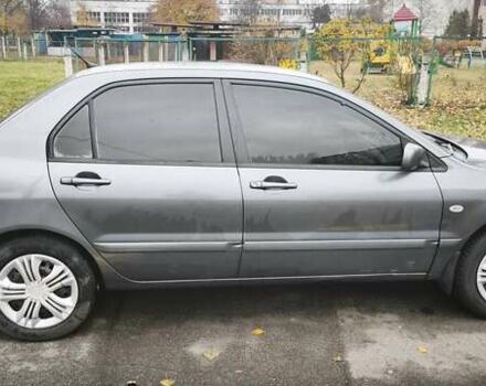 Серый Мицубиси Лансер, объемом двигателя 1.6 л и пробегом 263 тыс. км за 3800 $, фото 10 на Automoto.ua