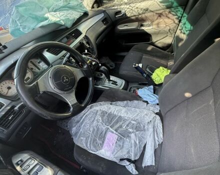 Серый Мицубиси Лансер, объемом двигателя 2 л и пробегом 200 тыс. км за 1500 $, фото 1 на Automoto.ua