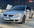 Сірий Міцубісі Lancer, об'ємом двигуна 1.58 л та пробігом 303 тис. км за 2800 $, фото 1 на Automoto.ua