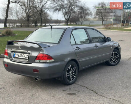 Сірий Міцубісі Lancer, об'ємом двигуна 1.58 л та пробігом 332 тис. км за 4650 $, фото 5 на Automoto.ua