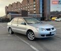 Серый Мицубиси Лансер, объемом двигателя 1.58 л и пробегом 220 тыс. км за 6200 $, фото 1 на Automoto.ua
