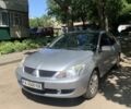 Серый Мицубиси Лансер, объемом двигателя 1.6 л и пробегом 140 тыс. км за 5000 $, фото 1 на Automoto.ua
