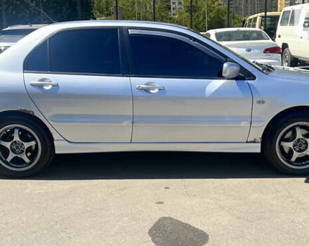 Сірий Міцубісі Lancer, об'ємом двигуна 1.58 л та пробігом 190 тис. км за 4900 $, фото 4 на Automoto.ua