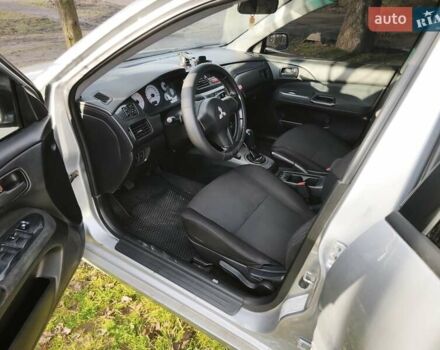 Серый Мицубиси Лансер, объемом двигателя 1.6 л и пробегом 234 тыс. км за 4300 $, фото 2 на Automoto.ua