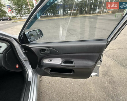 Серый Мицубиси Лансер, объемом двигателя 1.58 л и пробегом 183 тыс. км за 4800 $, фото 26 на Automoto.ua