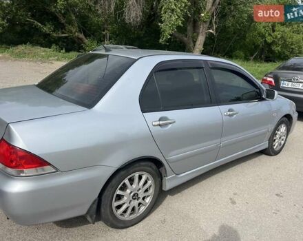 Сірий Міцубісі Lancer, об'ємом двигуна 1.58 л та пробігом 197 тис. км за 3450 $, фото 5 на Automoto.ua